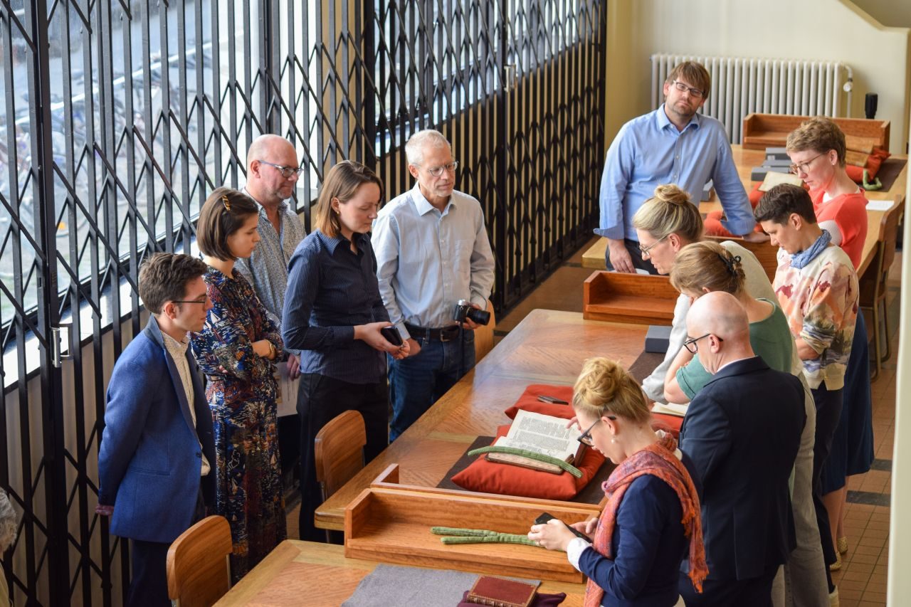 Participants viewing early printed books from Ghent University Library