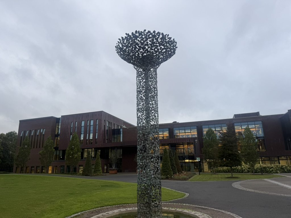 University of Limerick Glucksman library building with Tree of Life sculpture by Tom Fitzgerald in the foreground.